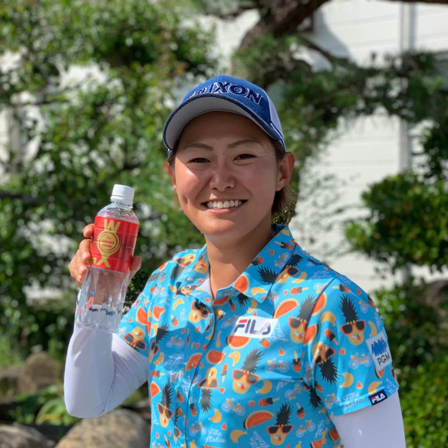 Professional golfer holding WOX on the course