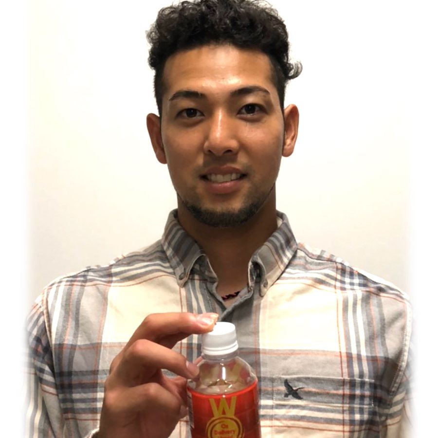 Professional baseball player holding a bottle of WOX