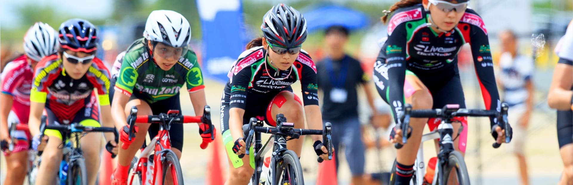 Peloton of road cyclists during a race in Japan